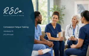 Healthcare professionals discussing workplace stress during a support session with Rachel Sandra Healthcare Solutions